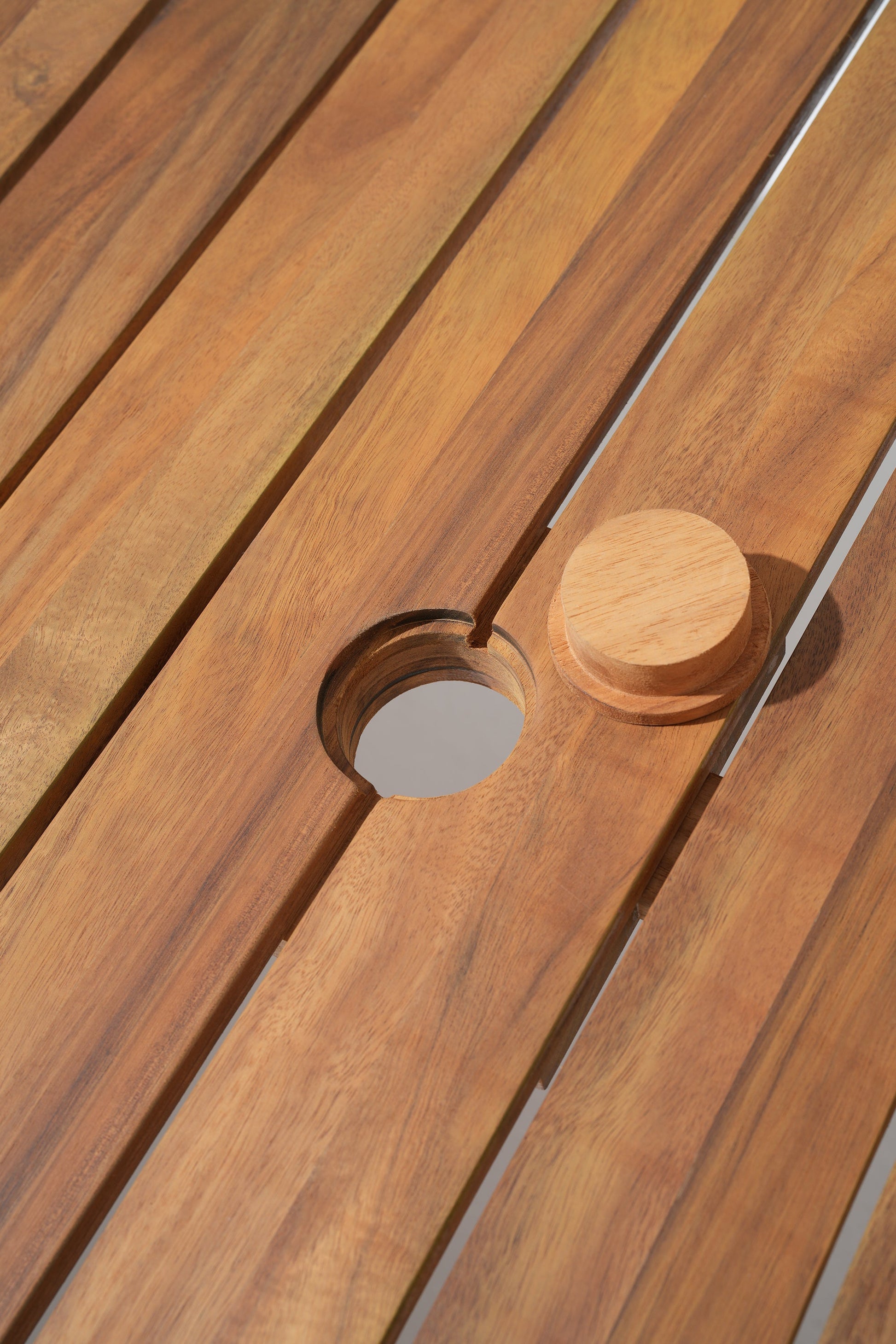 Wooden surface with a circular unbrella hole