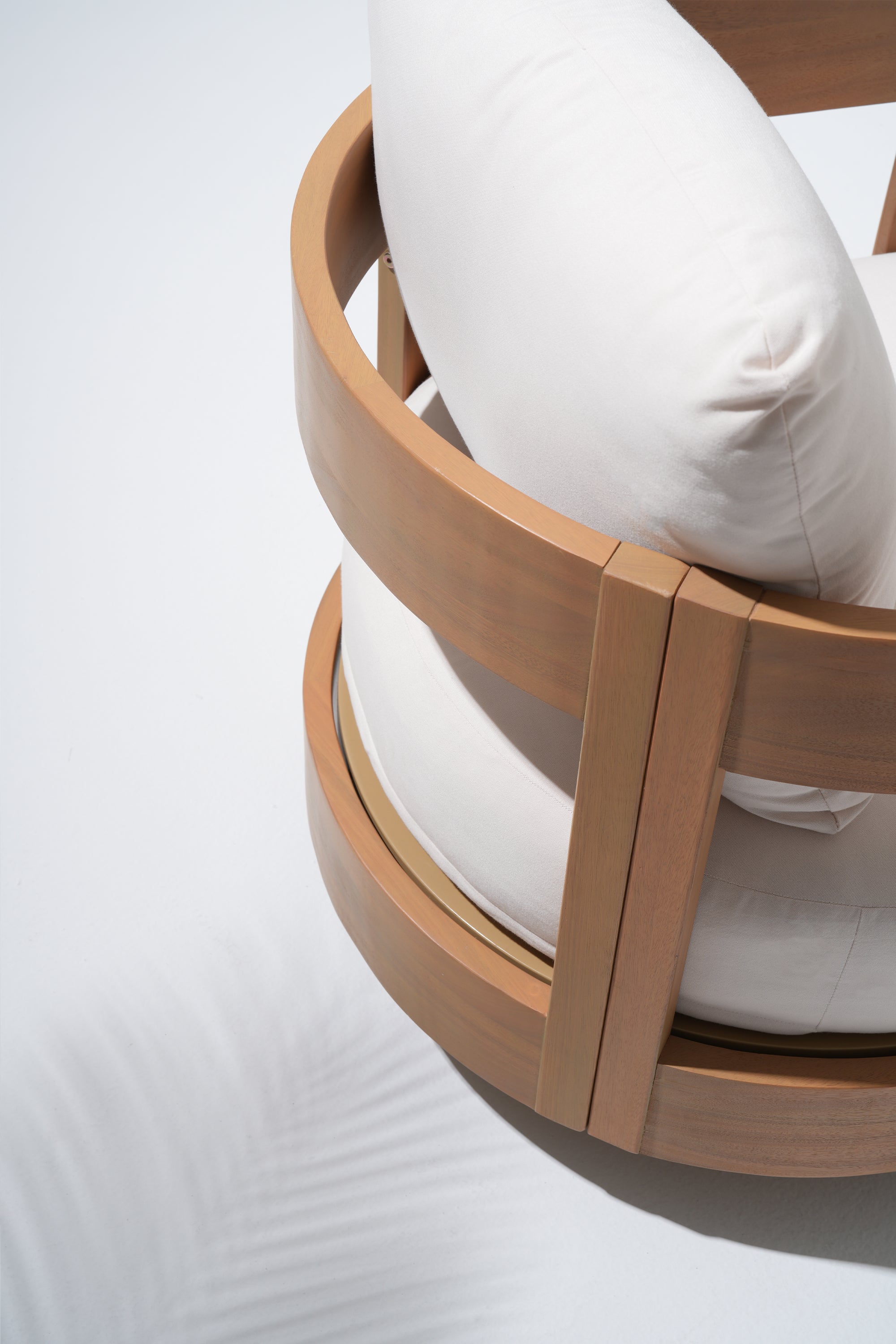 Wooden circular chair frame with white cushions 
