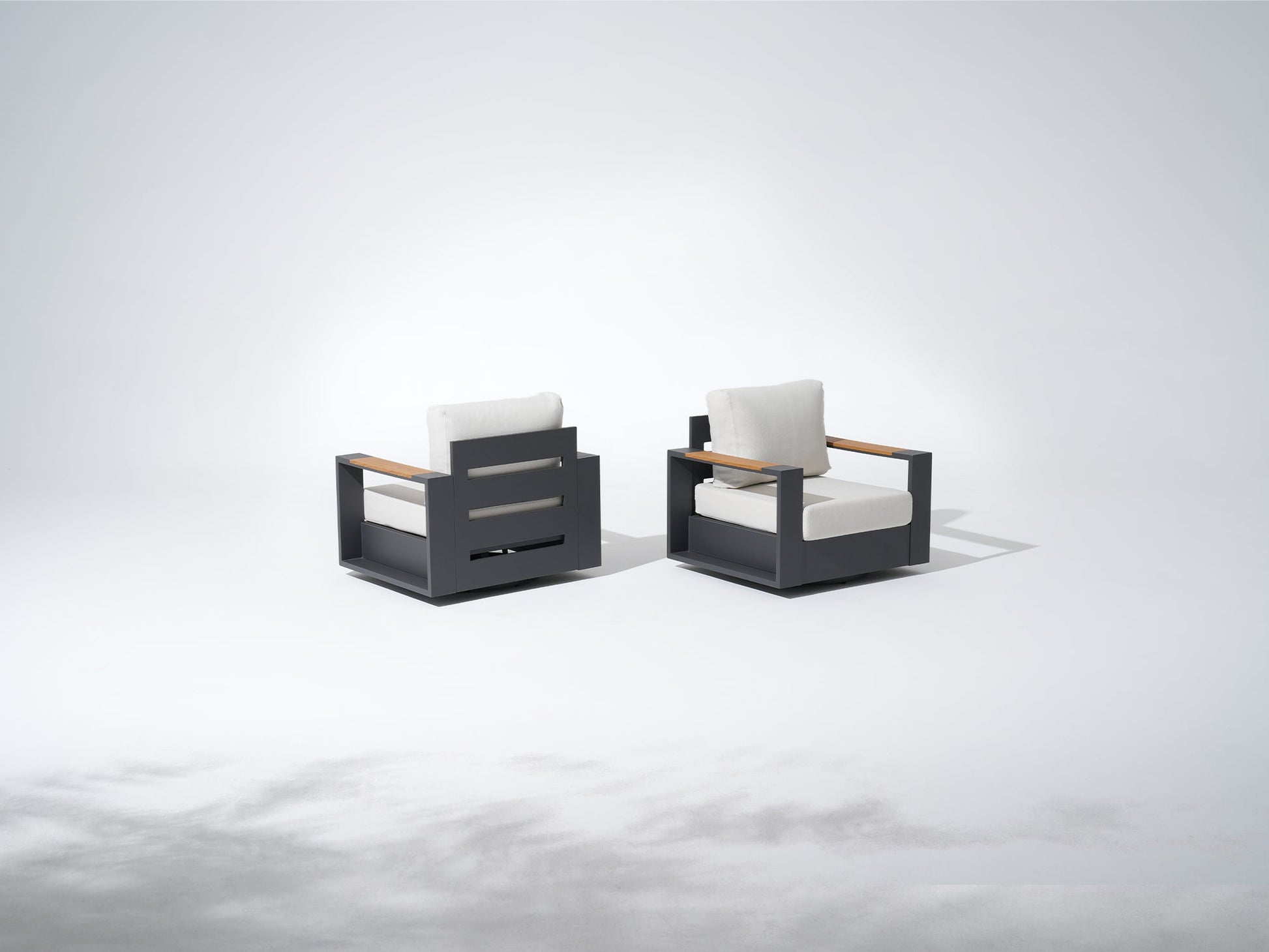 Two modern outdoor swivel chairs with white cushions, aluminum frame outdoor patio furniture sets