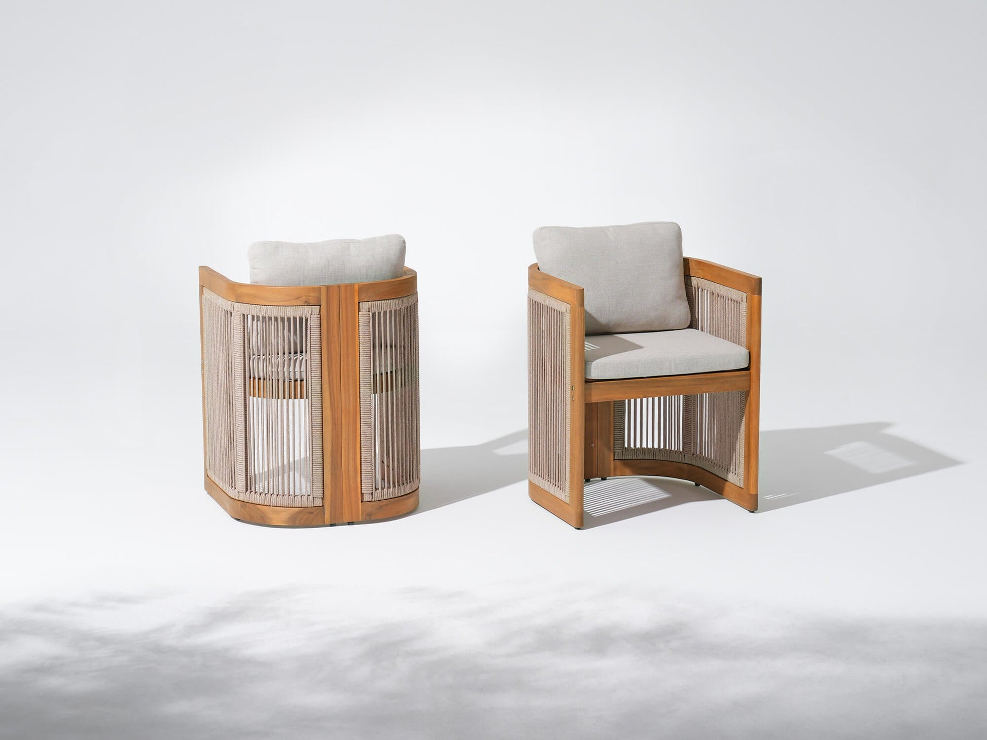 Two wooden patio dining chairs with woven rope backrests and grey cushions- Sunsitt Modern Premium Patio Outdoor Furniture