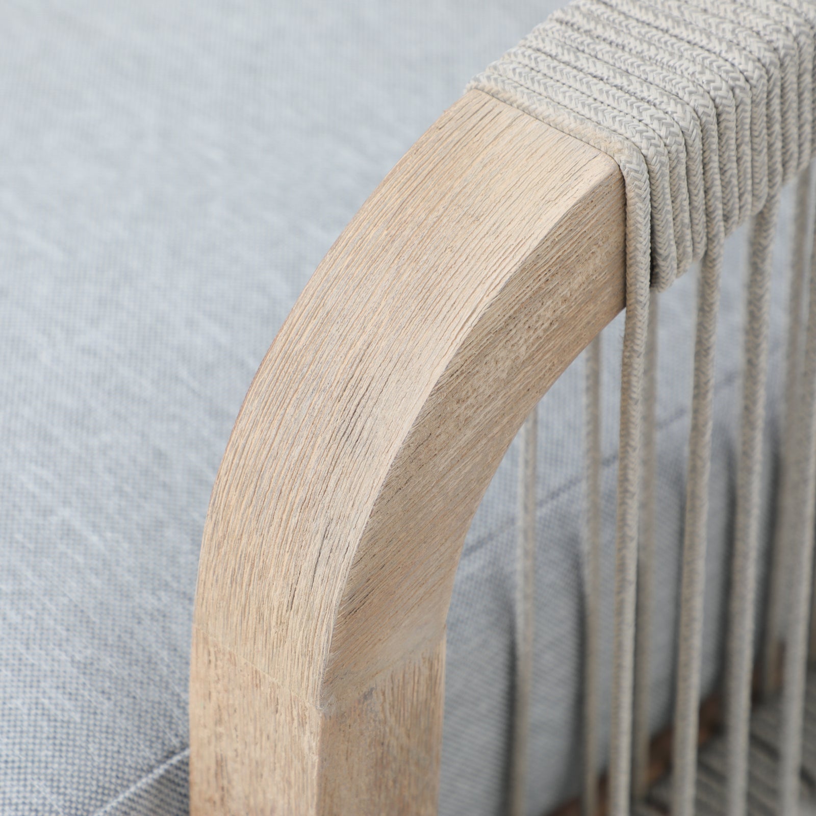 Thalea outdoor dining chair armrest with hand woven rope detail