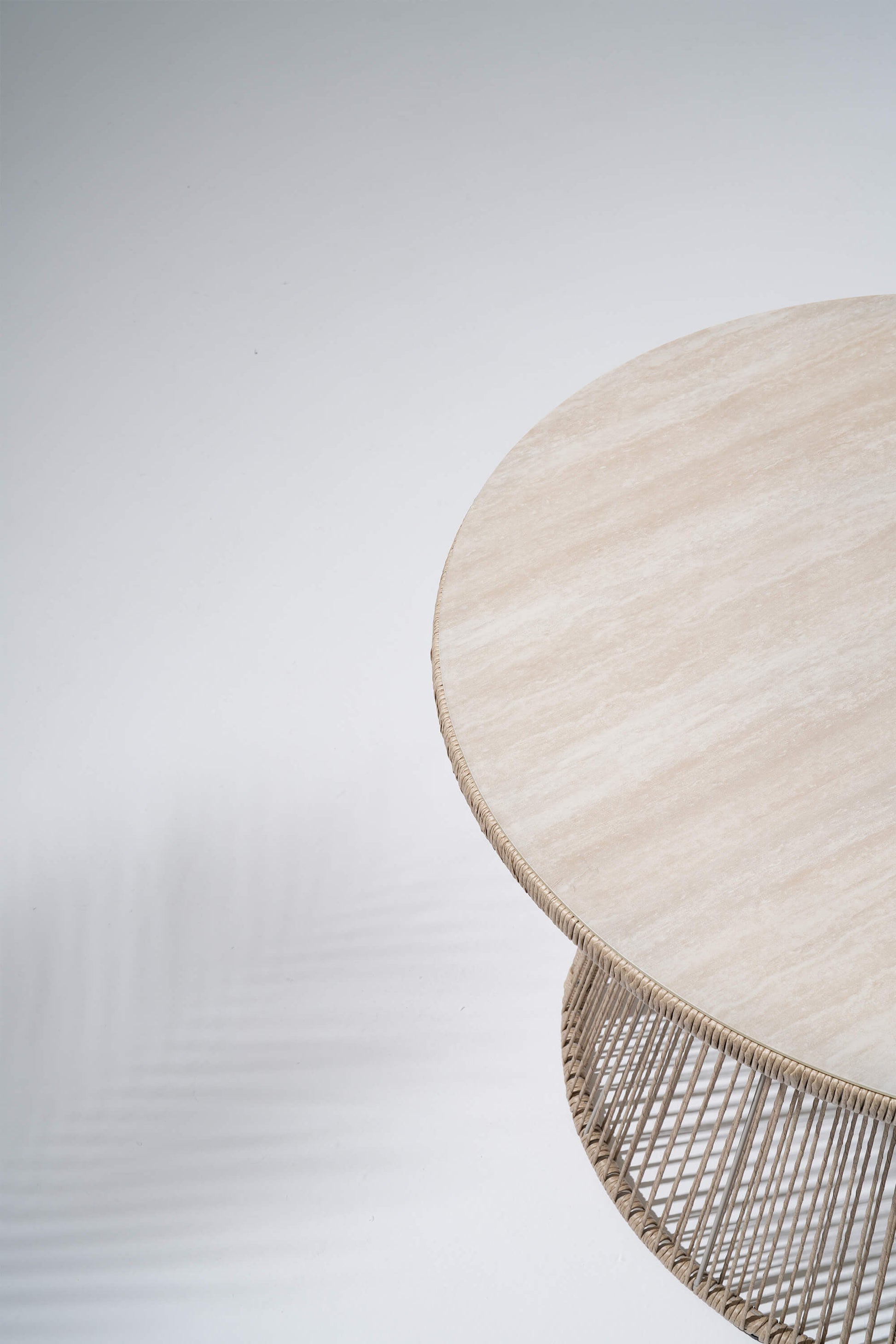 Round woven table with a textured surface