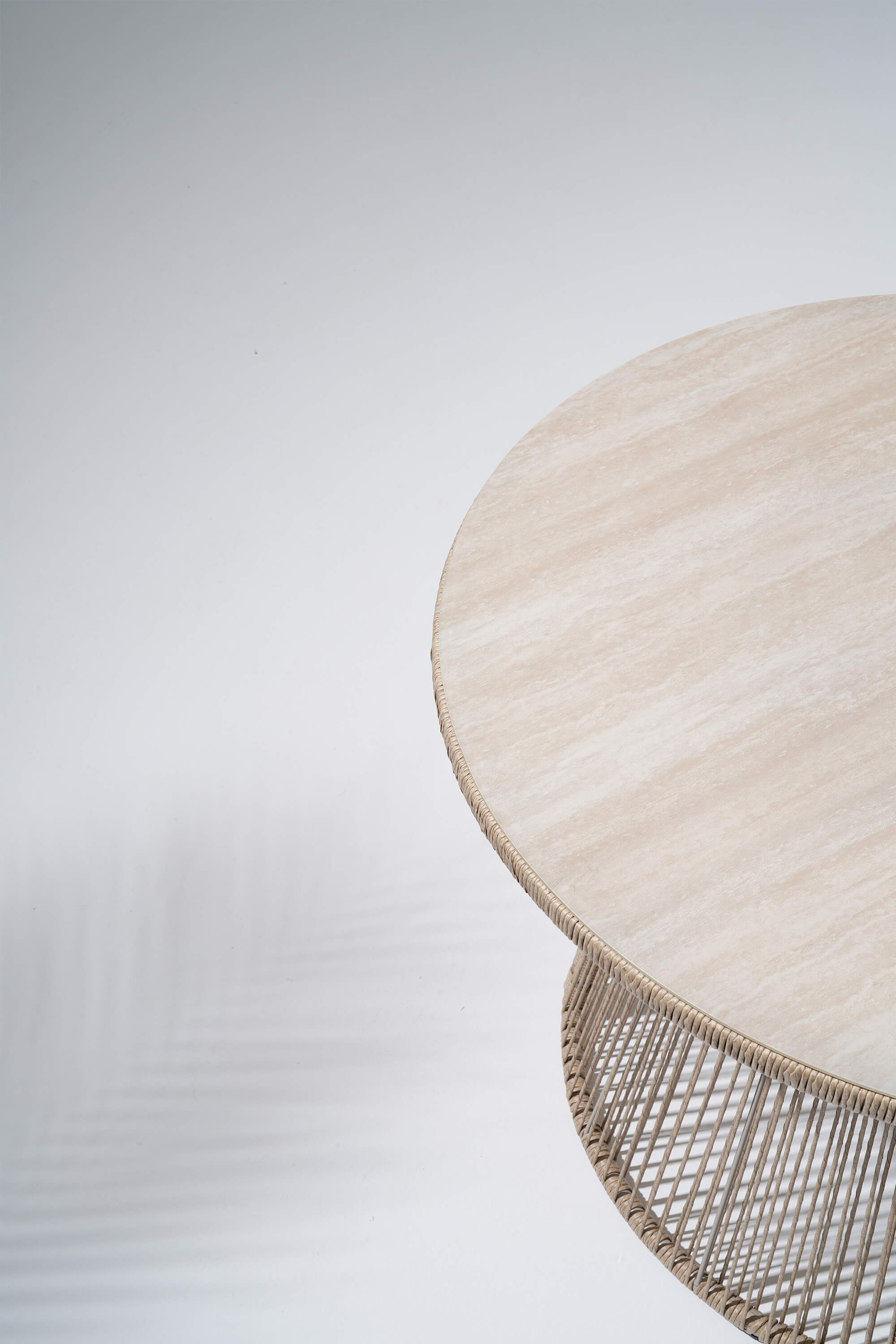 Round woven table with a textured surface