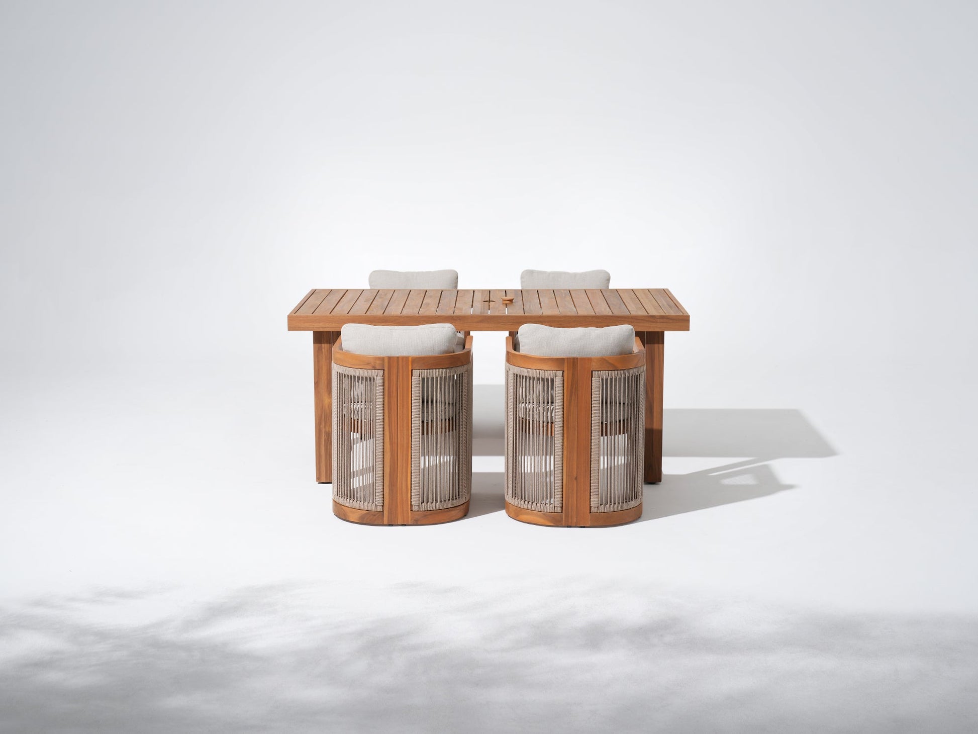 Wooden outdoor table with four chairs and umbrella hole