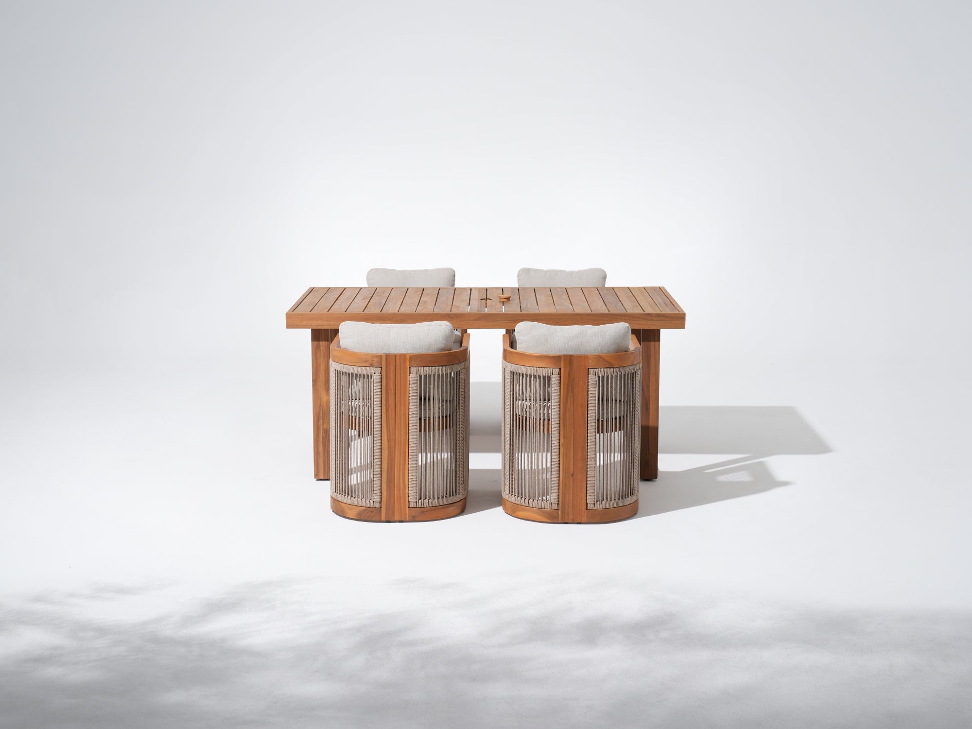Wooden outdoor table with four chairs and umbrella hole