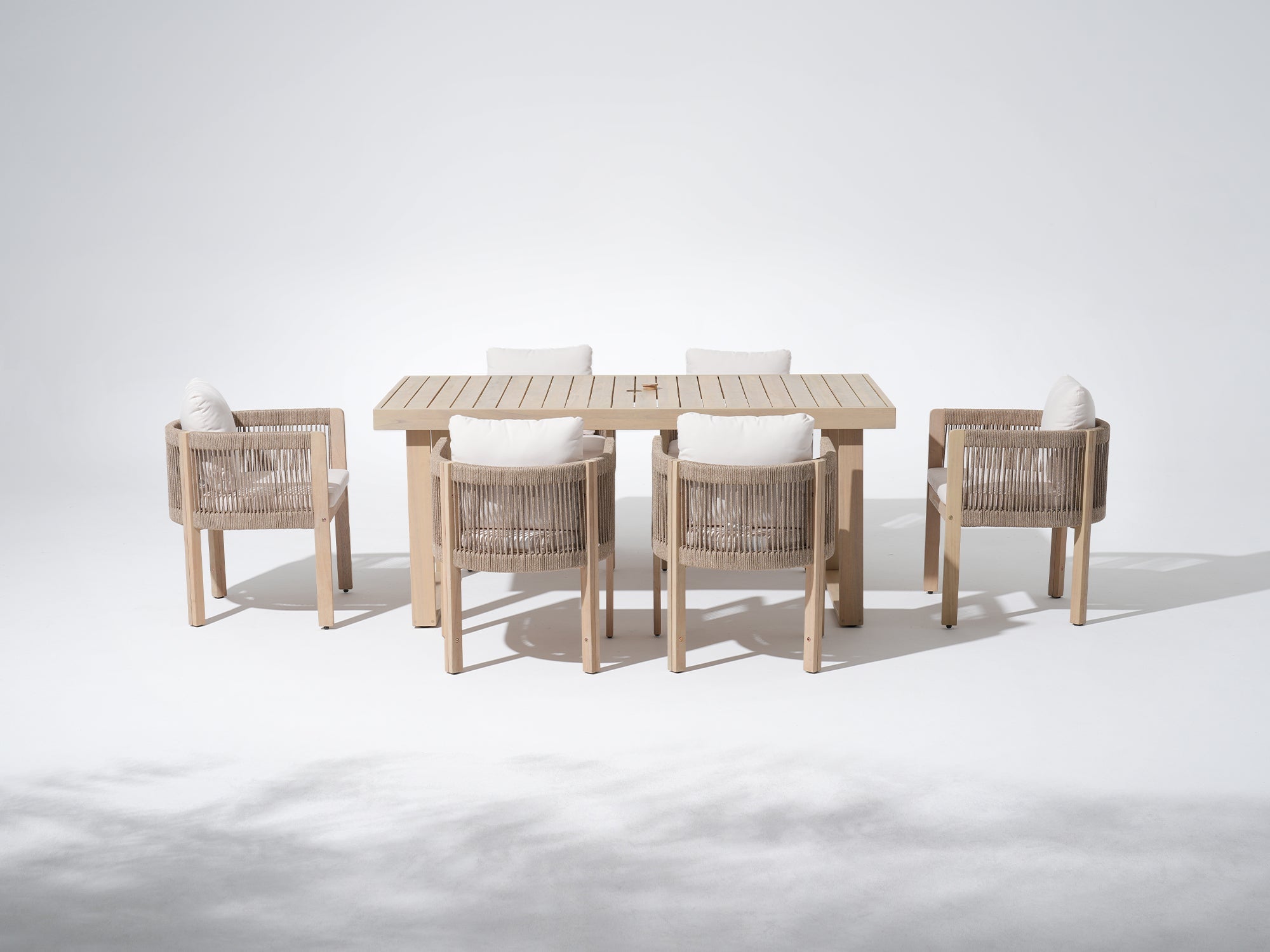 7-pc Outdoor furniture set with a rectangular table with an umbrella hole and six rope chairs