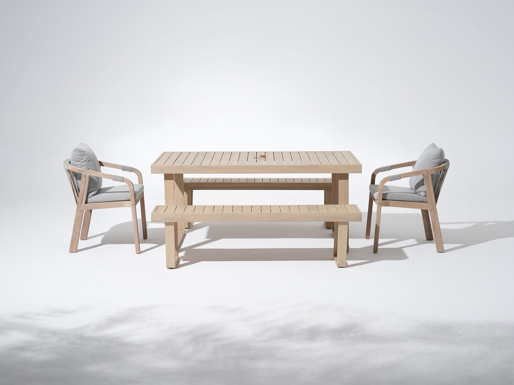 Wooden outdoor table set for 6 with umbrella hole, a table, two chairs and two benches