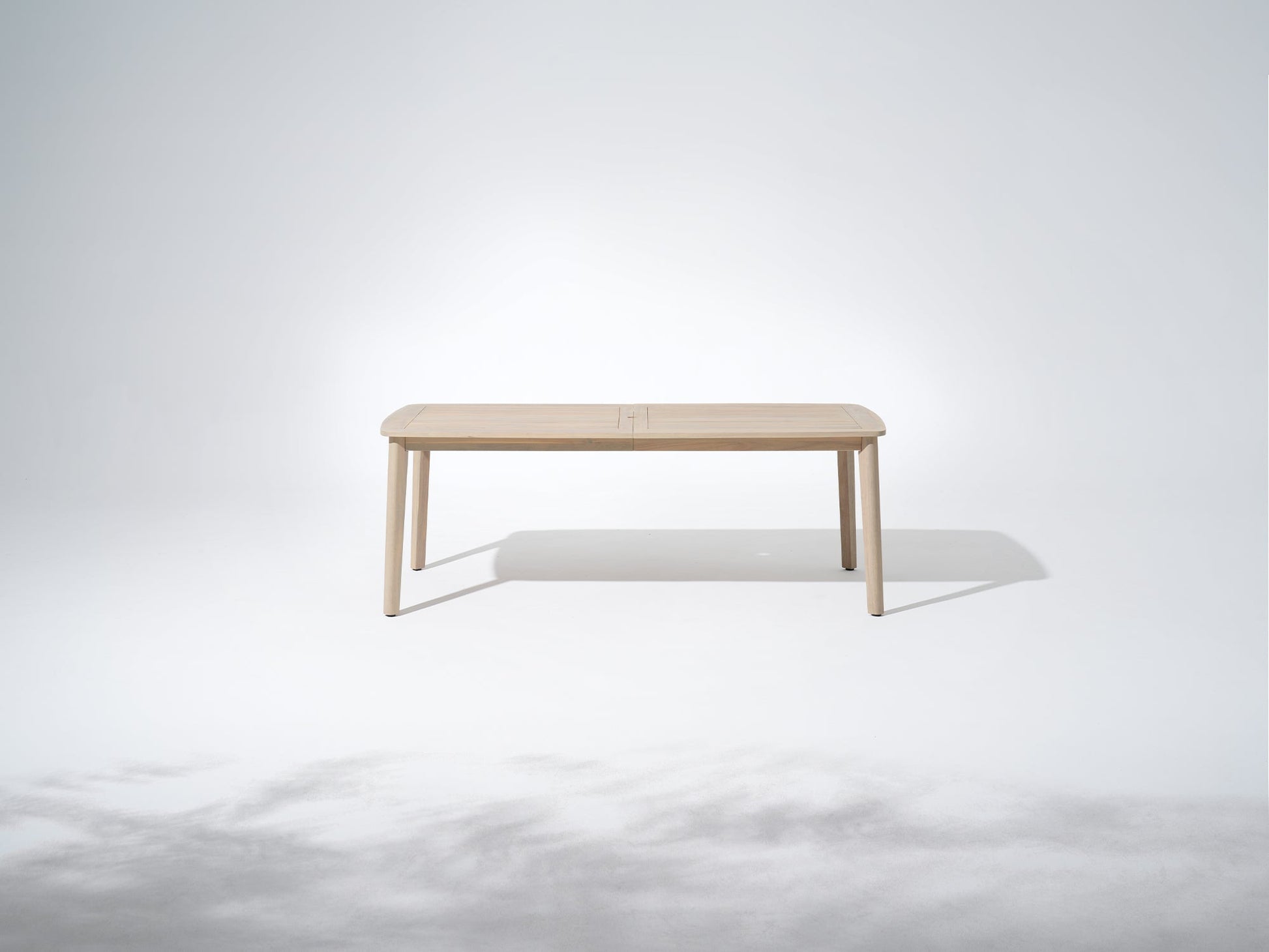 Wooden outdoor dining table with umbrella hole