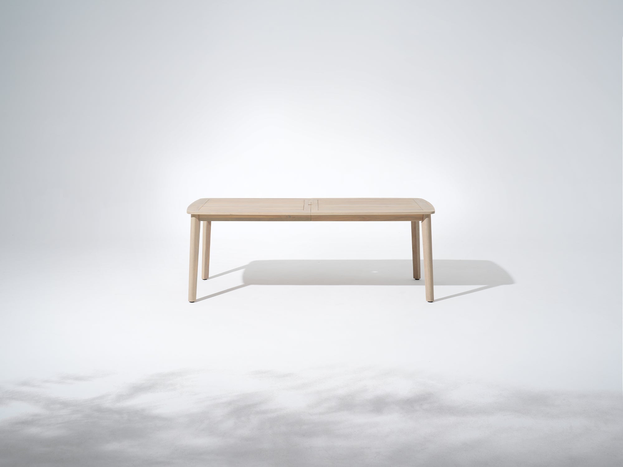 Wooden outdoor dining table with umbrella hole