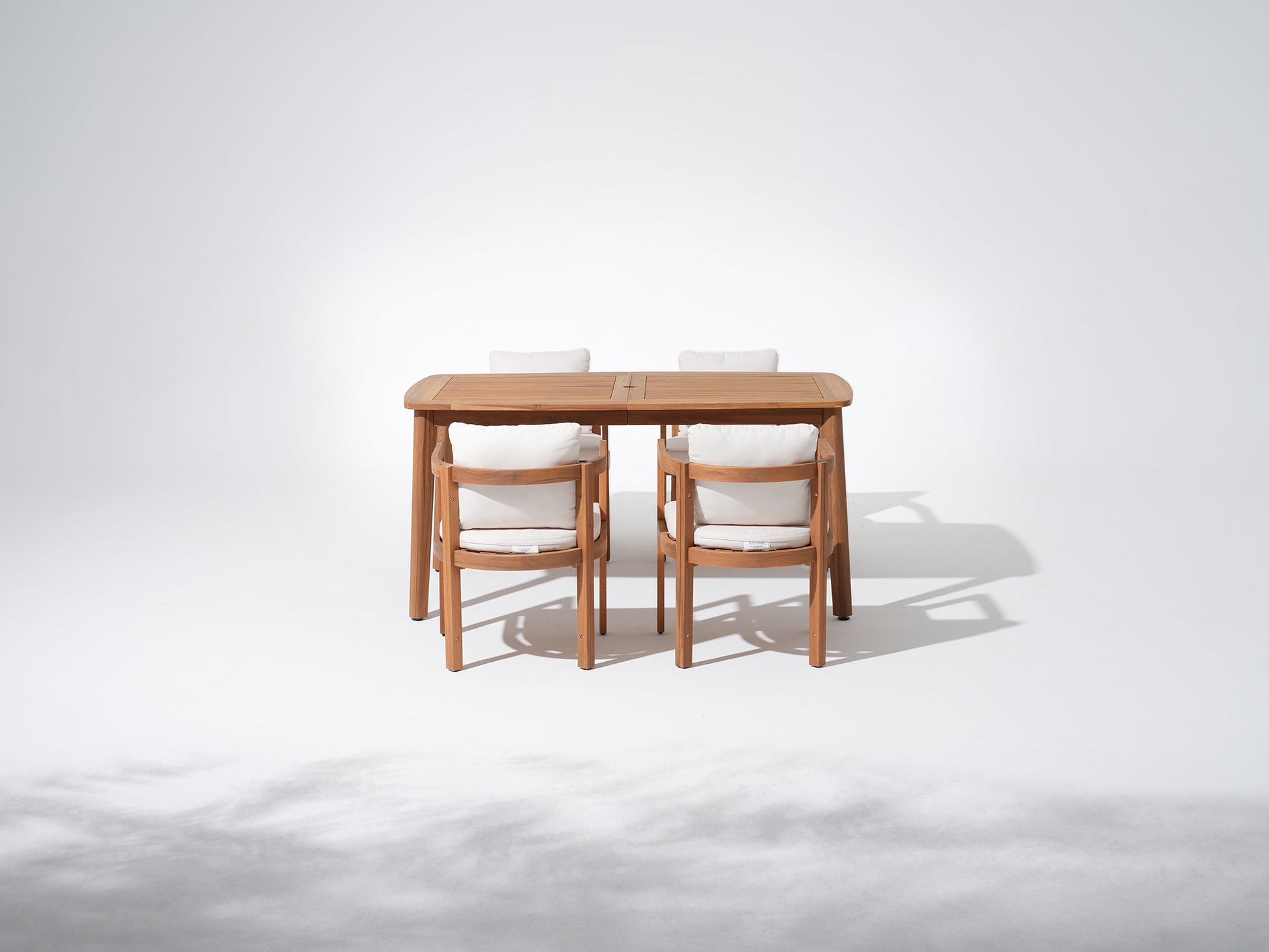 Wooden dining table with four chairs and umbrella hole