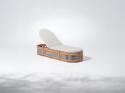 Modern lounge chair with wooden frame and white cushion
