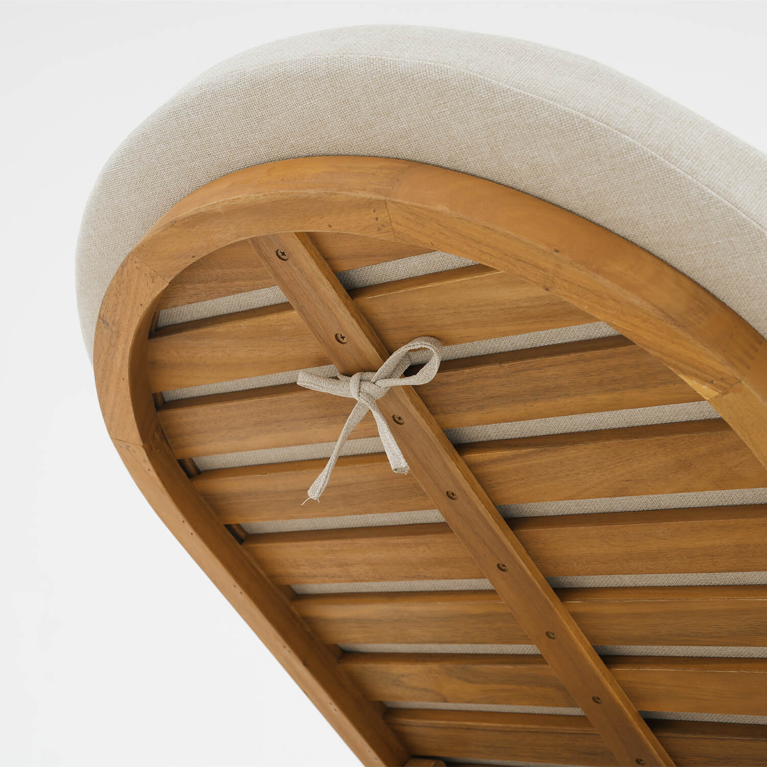 outdoor lounge chair, cushion straps tied to the wooden frame