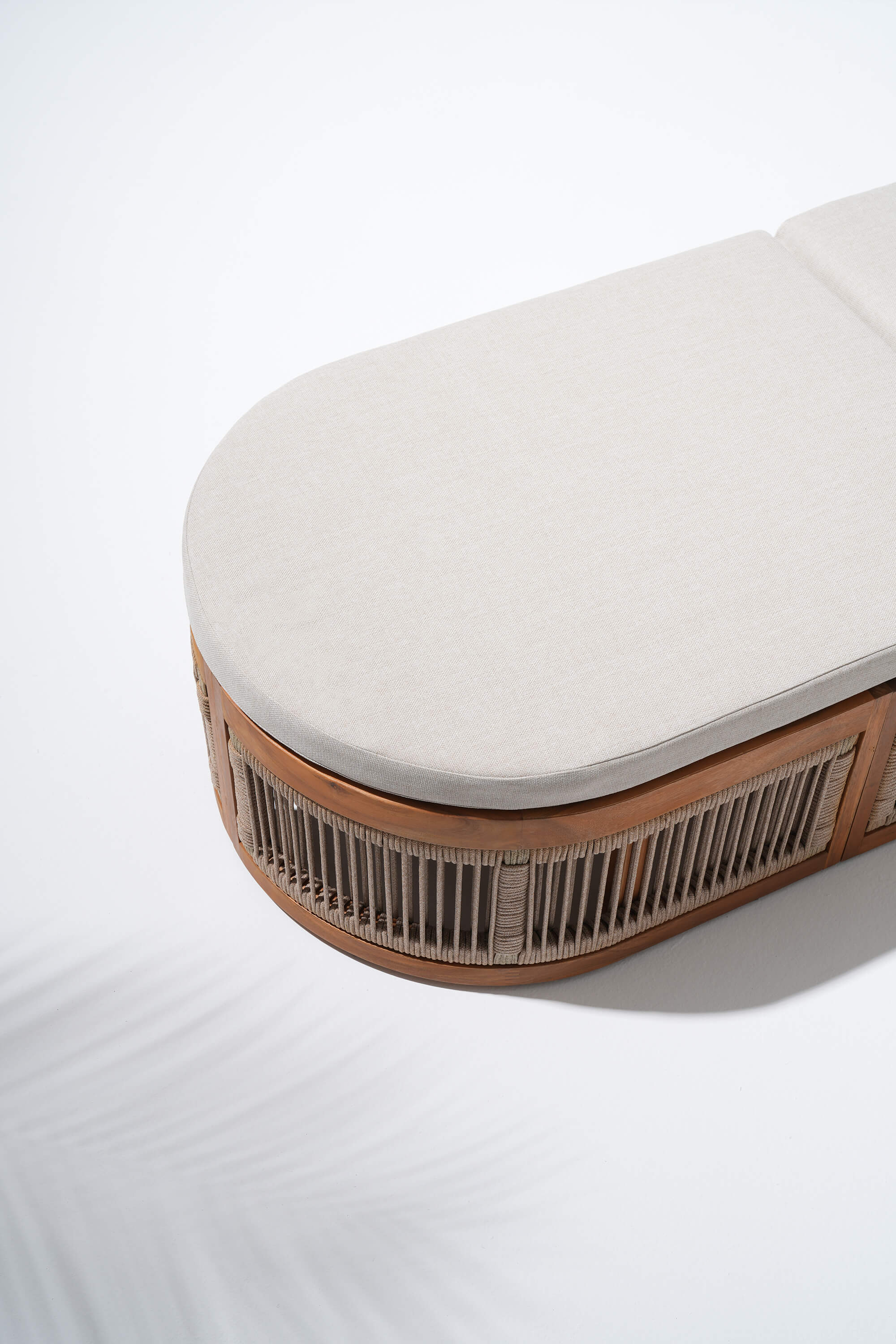 Oval-shaped cushion with wooden frame