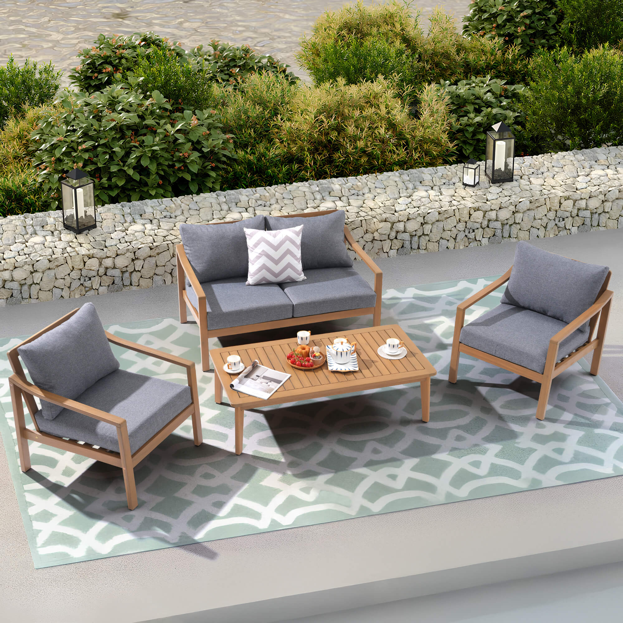 Noto gray Outdoor conversation furniture set with wooden chairs and table on a patterned rug- Sunsitt Modern Premium Patio Outdoor Furniture