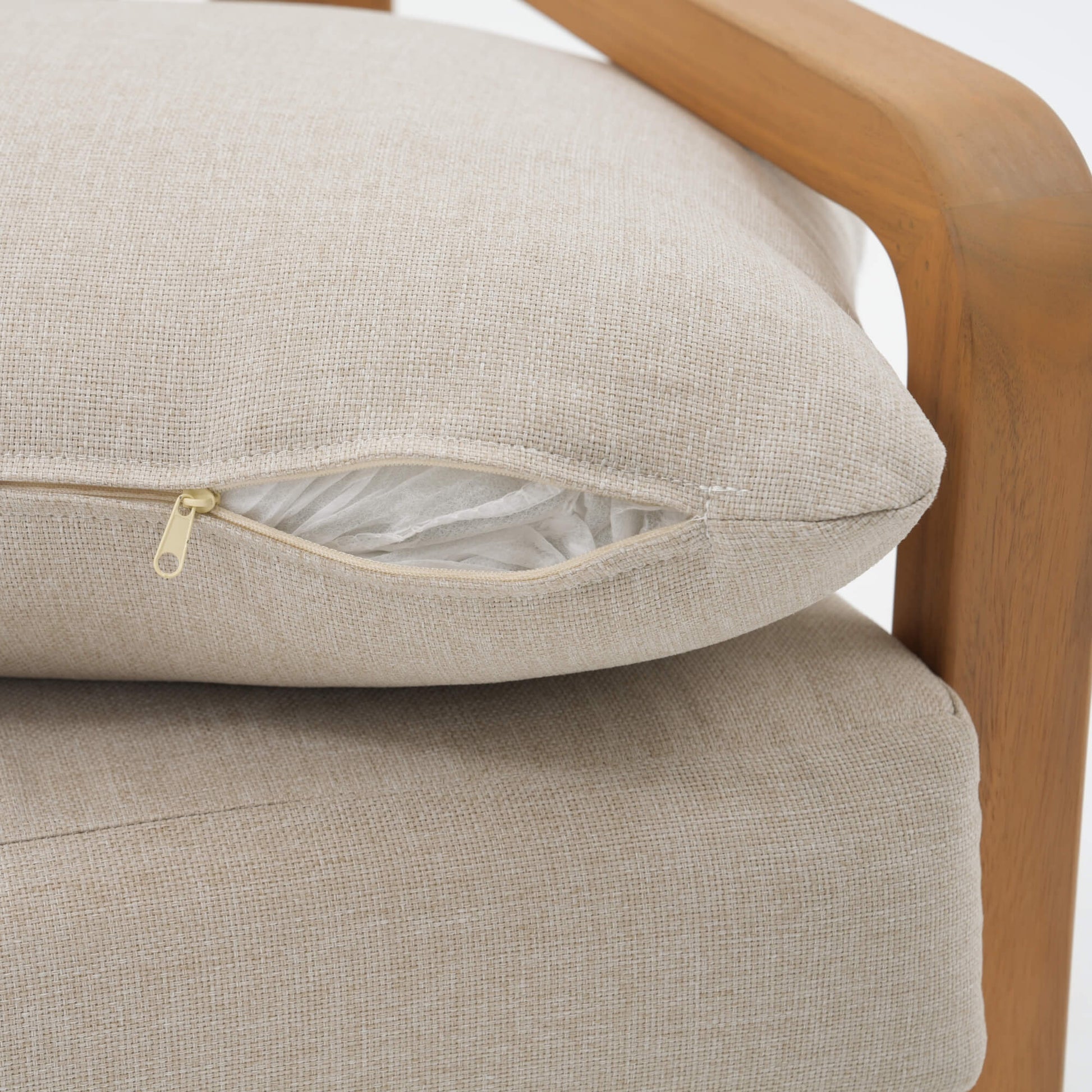 Beige cushion on a wooden chair with zip detail
