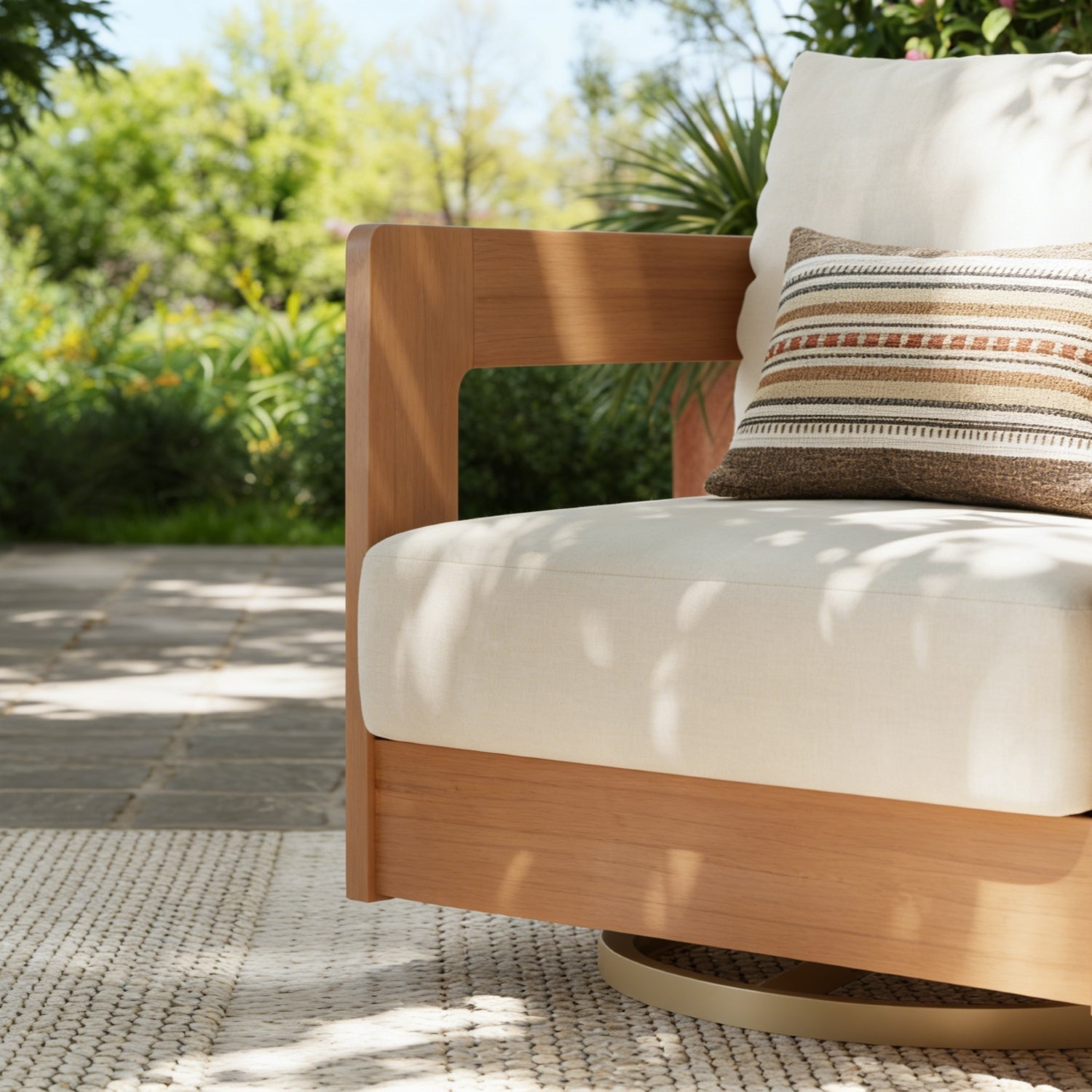 Wooden outdoor swivel chair with white cushion, side angle