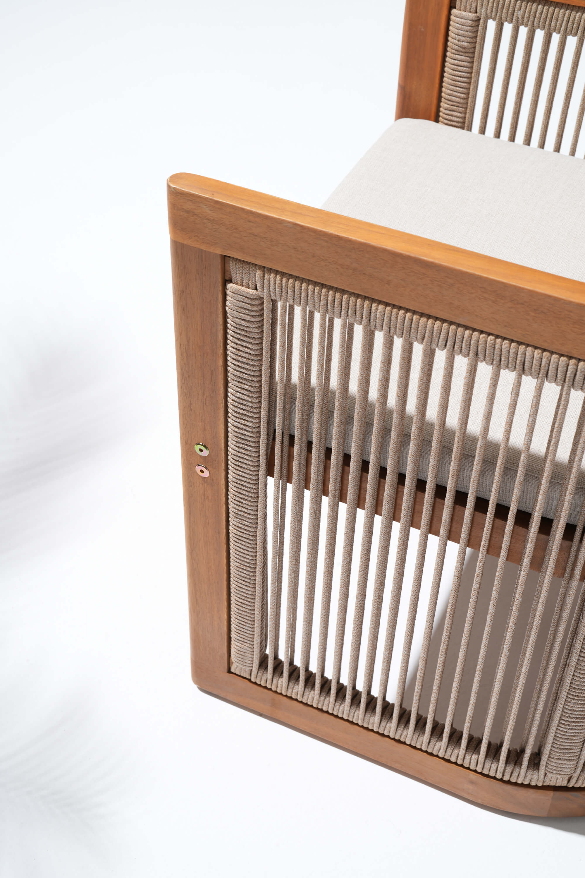 Close-up of a wooden chair with woven rope backrest- Sunsitt Modern Premium Patio Outdoor Furniture