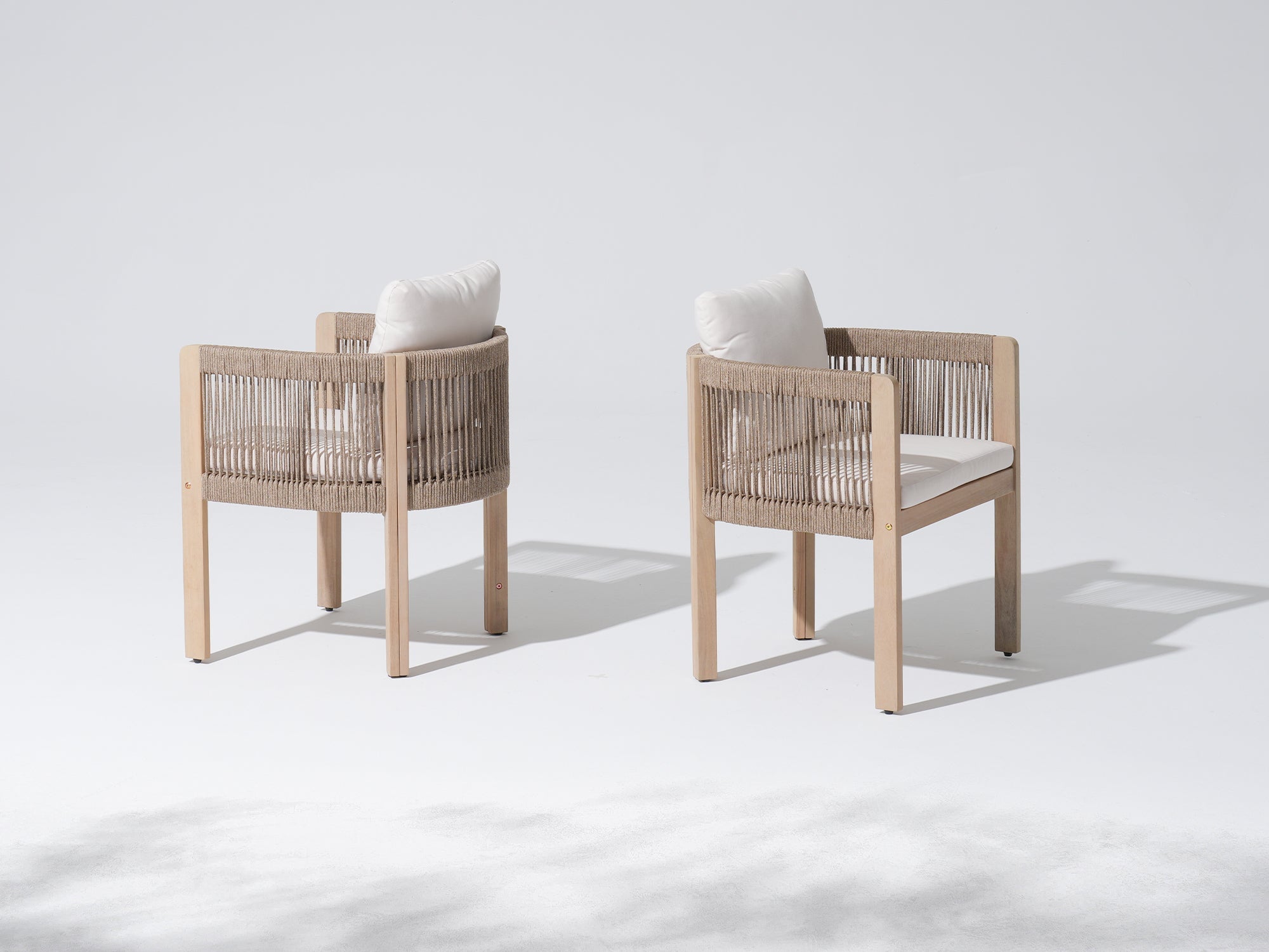 Two wooden chairs with woven rope backrests and white cushions- Sunsitt Modern Premium Outdoor Patio Furniture