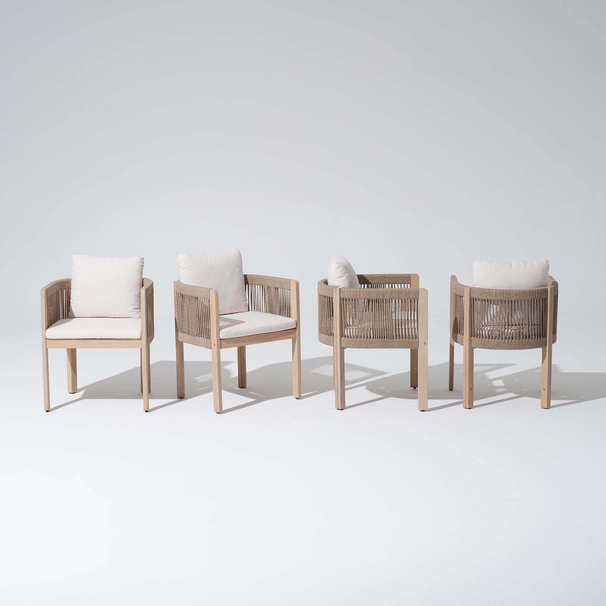 Four wooden patio dining chairs with woven armrests and white cushions- Sunsitt Modern Premium Outdoor Patio Furniture