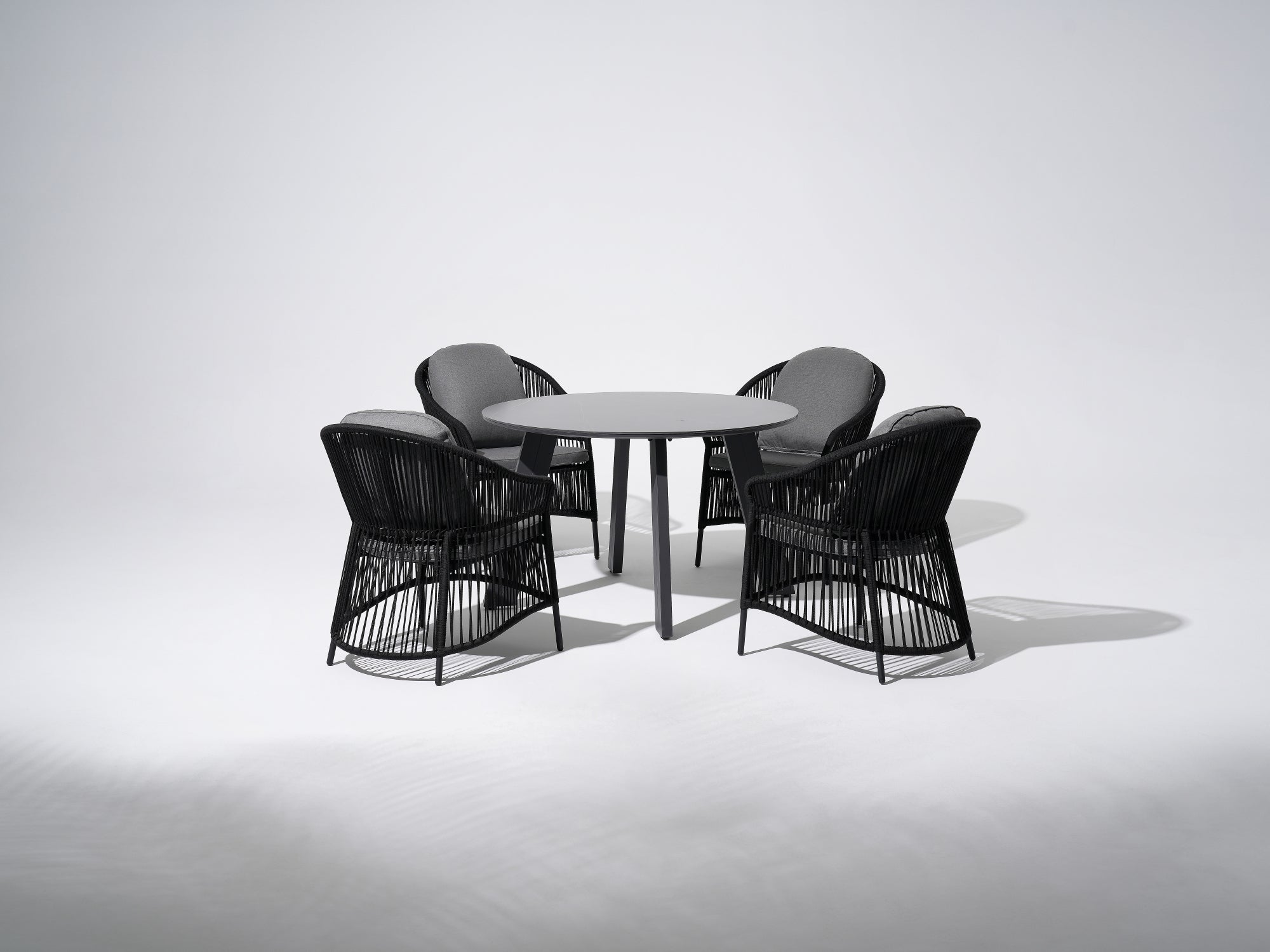 Aluminum Outdoor Dining Set For 4,  grey aluminum round dining table and four dining chairs with black rope design and gray cushions - SUNSITT Premium Modern Outdoor Patio Dining Furniture Set