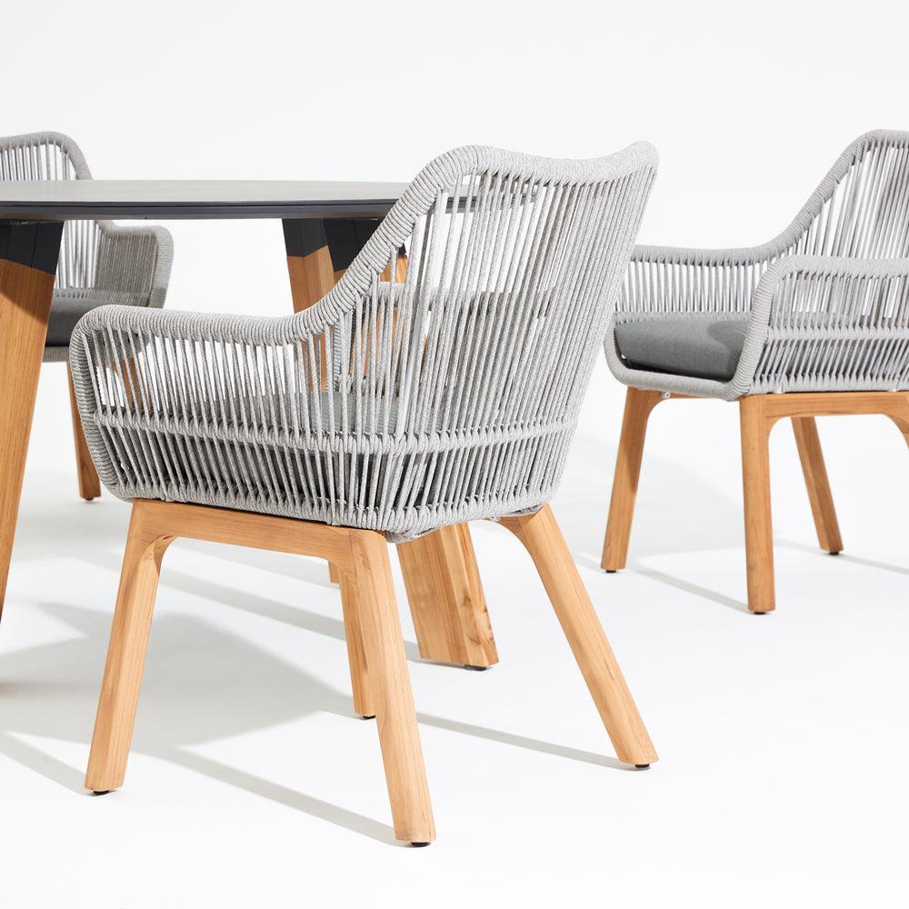  Natural Collection - Coronado Dining Arm Chairs, smooth armrest,classic design, grey rope accent, plush grey cushion, teak legs, round dining table with sintered stone tabletop- Sunsitt Signature